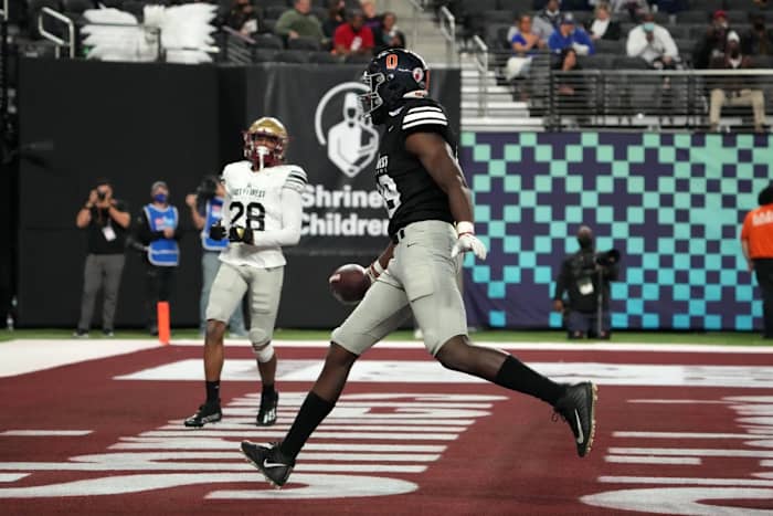 Feb 3, 2022; Las Vegas, NV, USA; West tight end Jelani Woods of Virginia (89) celebrates after scoring a touchdown ]against the East in the second half of the East-West Shrine Bowl at Allegiant Stadium.