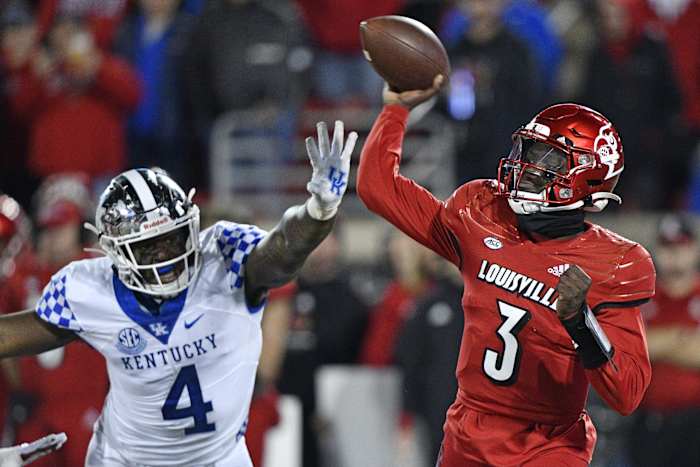 Nov 27, 2021; Louisville, Kentucky, USA; Louisville Cardinals quarterback Malik Cunningham (3) throws a pass against Kentucky Wildcats defensive end Josh Paschal (4) during the second quarter at Cardinal Stadium. Mandatory Credit: Jamie Rhodes-USA TODAY Sports