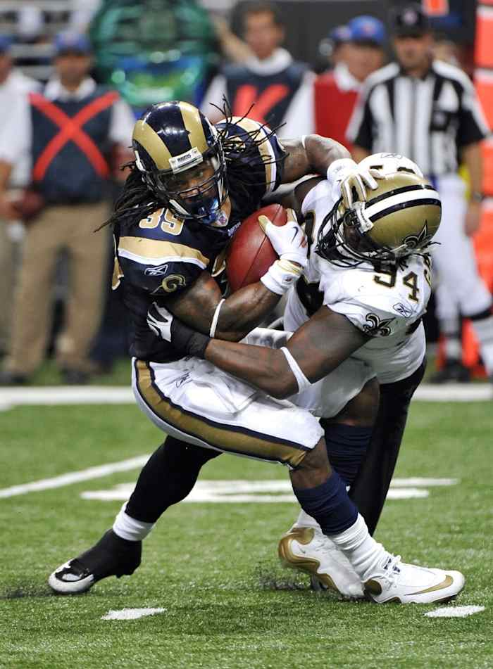 St. Louis Rams running back Steven Jackson (39) is tackled for a loss by New Orleans Saints defensive end Charles Grant (94). Mandatory Credit: Photo by Scott Rovak-USA TODAY