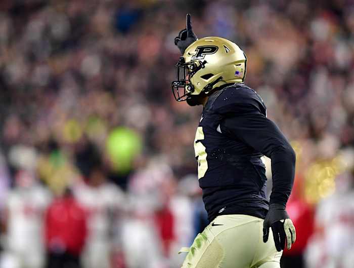 Nov 27, 2021; West Lafayette, Indiana, USA; Purdue Boilermakers defensive end George Karlaftis (5) celebrates a sack during the second half against the Indiana Hoosiers at Ross-Ade Stadium. Boilermakers won 44-7. Mandatory Credit: Marc Lebryk-USA TODAY Sports