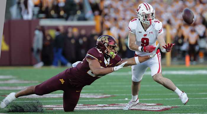Wisconsin safety Scott Nelson (No. 9) intercepting a pass against Minnesota (Credit: Mark Hoffman / Milwaukee Journal Sentinel / USA TODAY NETWORK)