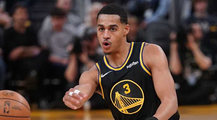Golden State Warriors guard Jordan Poole (3) passes the ball against the Denver Nuggets in the third quarter during game one of the first round for the 2022 NBA playoffs at the Chase Center.