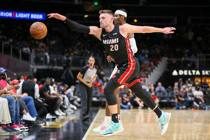 Former Wisconsin forward Micah Potter going for a loose ball with the Miami Heat (Credit: Brett Davis-USA TODAY Sports)