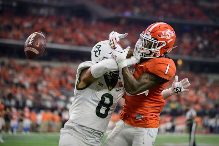 Baylor safety Jalen Pitre (8) breaks up a pass intended for Oklahoma State receiver Tay Martin (1) in the Big 12 Conference championship game. Mandatory Credit: Jerome Miron-USA TODAY