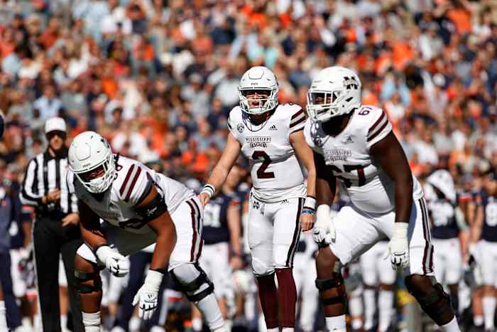 Nov 13, 2021; Auburn, Alabama, USA; Mississippi State Bulldogs quarterback Will Rogers (2) as changes the play during the first quarter against the Auburn Tigers at Jordan-Hare Stadium. Mississippi State offensive lineman Charles Cross (67) listens at right. Mandatory Credit: John Reed-USA TODAY Sports