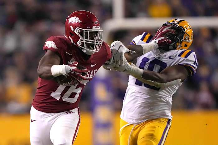 Arkansas Razorbacks wide receiver Treylon Burks (16) runs the ball against LSU linebacker Mike Jones Jr. (19). Mandatory Credit: Kirby Lee-USA TODAY Sports