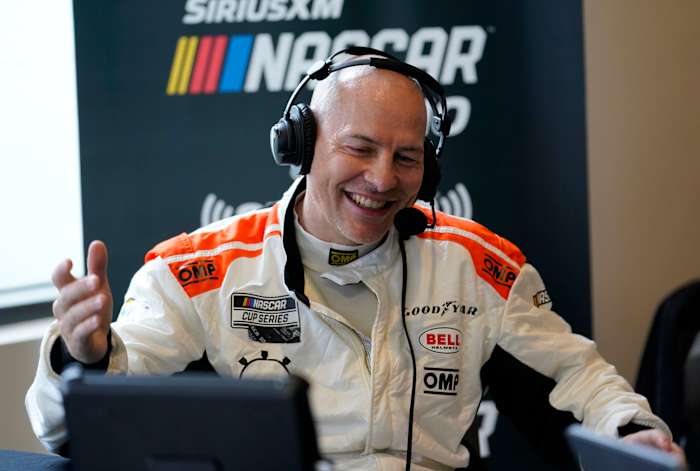 Jacques Villeneuve talks to the press during 2022 Daytona 500 media day at Daytona International Speedway. Photo: Mike Dinovo / USA Today Sports