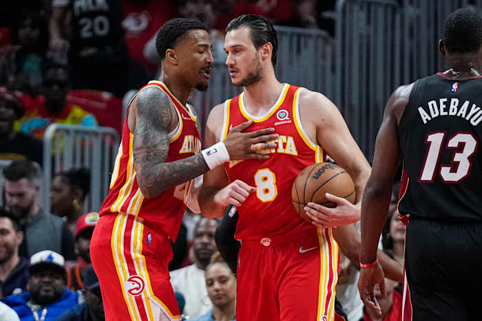 Apr 22, 2022; Atlanta, Georgia, USA; Atlanta Hawks forwards John Collins (20) and Danilo Gallinari (8) react after a basket against the Miami Heat during the first half of game three of the first round for the 2022 NBA playoffs at State Farm Arena.