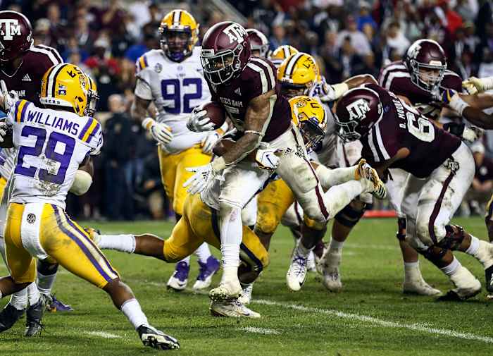 Nov 24, 2018; College Station, TX, USA; Texas A&M Aggies running back Trayveon Williams (5) runs with the ball during overtime against the LSU Tigers at Kyle Field. Mandatory Credit: Troy Taormina-USA TODAY Sports