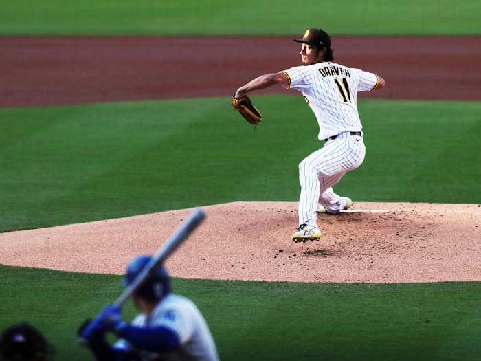 San Diego Padres starting pitcher Yu Darvish winds up before throwing to a Los Angeles Dodgers batter during the first inning of a baseball game Saturday, April 23, 2022, in San Diego.