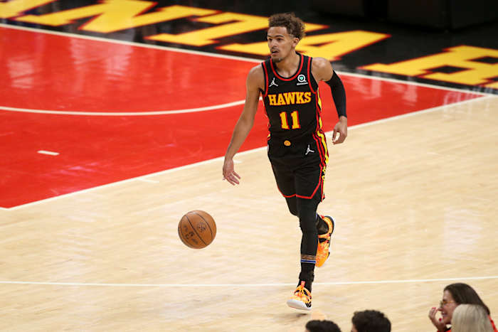 Apr 24, 2022; Atlanta, Georgia, USA; Atlanta Hawks guard Trae Young (11) dribbles against the Miami Heat in the first quarter during game four of the first round for the 2022 NBA playoffs at State Farm Arena.