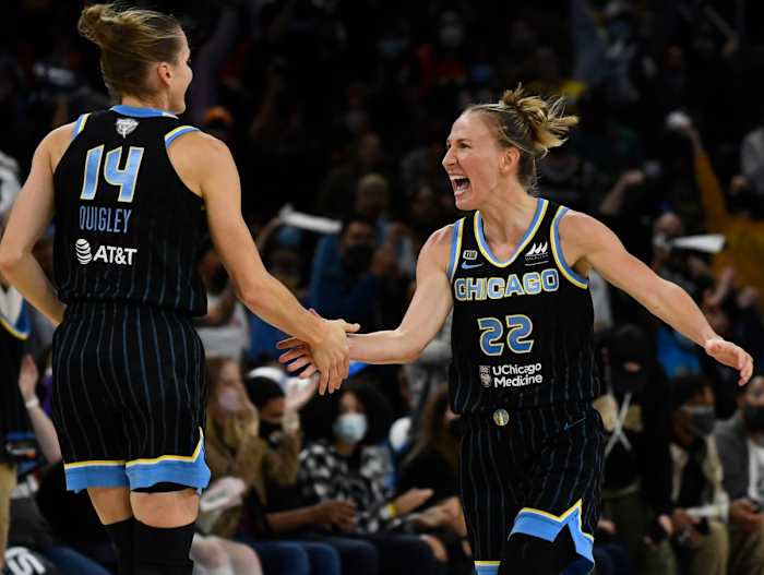 Allie Quigley low-fives her wife, Courtney Vandersloot