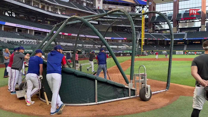 Rangers  Brad Miller Takes Batting Practice in Jeans