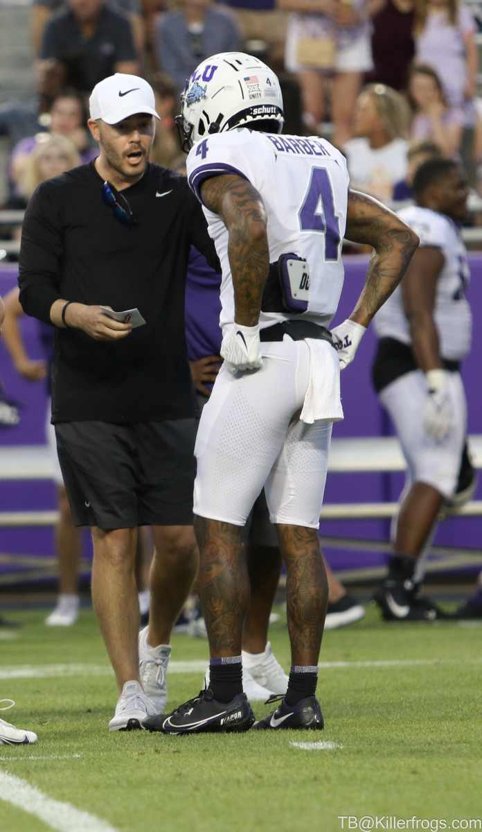 Coach Riley coaching WR, Taye Barber, TCU Spring Football Game