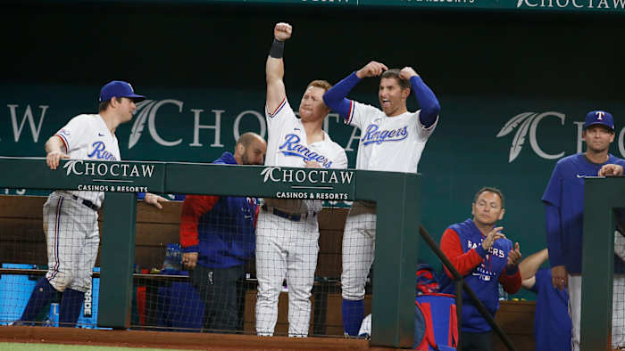 Apr 25, 2022; Arlington, Texas, USA; Texas Rangers right fielder Kole Calhoun (56) reacts after Texas Rangers right fielder Adolis Garcia (not pictured) doubles in three runs in the eighth inning against the Houston Astros at Globe Life Field. Mandatory Credit: Tim Heitman-USA TODAY Sports