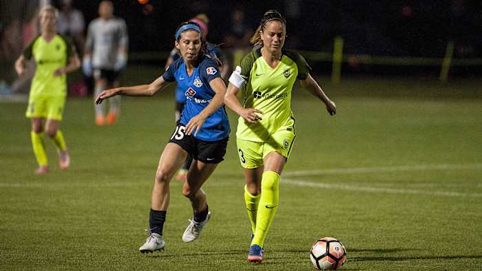 Erika Tymrak and Lauren Barnes in a 2017 NWSL match