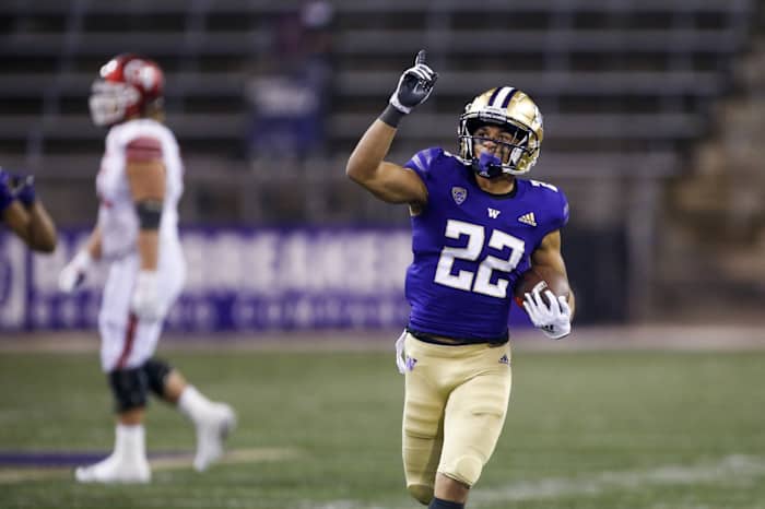 Nov 28, 2020; Seattle, Washington, USA; Washington Huskies defensive back Trent McDuffie (22) celebrates following an interception against the Utah Utes during the fourth quarter at Alaska Airlines Field at Husky Stadium. Mandatory Credit: Joe Nicholson-USA TODAY Sports