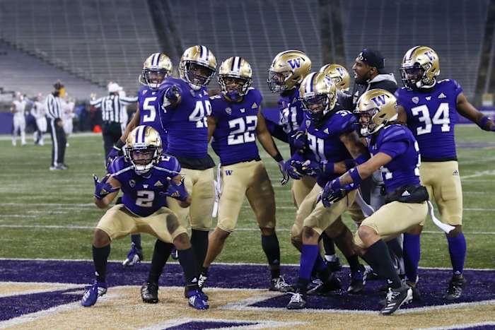 Nov 28, 2020; Seattle, Washington, USA; Washington Huskies defensive back Trent McDuffie (22) celebrates with teammates including defensive back Kyler Gordon (2) and linebacker Edefuan Ulofoshio (48) and defensive lineman Tuli Letuligasenoa (91) and defensive back Kamren Fabiculanan (31) following an interception against the Utah Utes during the fourth quarter at Alaska Airlines Field at Husky Stadium. Mandatory Credit: Joe Nicholson-USA TODAY Sports