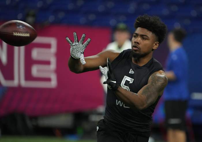 Arkansas wide receiver Treylon Burks (WO05) goes through drills during the 2022 NFL Scouting Combine at Lucas Oil Stadium.