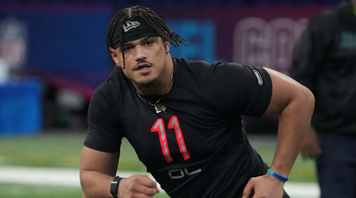 Houston defensive lineman Logan Hall (DL11) goes through drills during the 2022 NFL Scouting Combine at Lucas Oil Stadium.