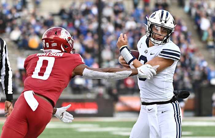 Oct 23, 2021; Pullman, Washington, USA; Brigham Young Cougars quarterback Jaren Hall (3) and Washington State Cougars defensive back Jaylen Watson (0) in the second half at Gesa Field at Martin Stadium. BYU won 21-19. Mandatory Credit: James Snook-USA TODAY Sports