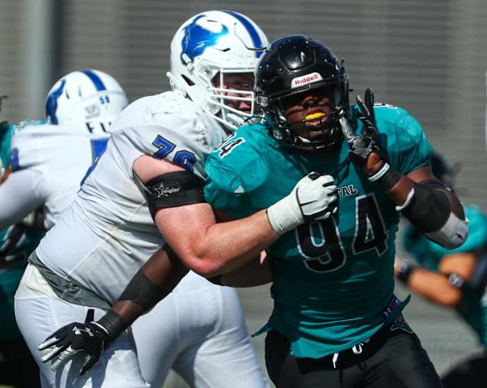 Sep 18, 2021; Buffalo, New York, USA; Coastal Carolina Chanticleers linebacker Jeffrey Gunter (94) fights his way thru a block by Buffalo Bulls offensive lineman Nicholas Fronczak (76) during the fourth quarter of play at UB Stadium. Mandatory Credit: Nicholas LoVerde-USA TODAY Sports