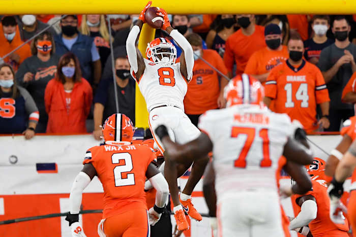 Oct 15, 2021; Syracuse, New York, USA; Clemson Tigers wide receiver Justyn Ross (8) catches the ball in front of Syracuse Orange linebacker Marlowe Wax (2) during the first half at the Carrier Dome. Mandatory Credit: Rich Barnes-USA TODAY Sports