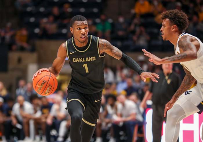 Oakland Golden Grizzlies forward Jamal Cain (1) dribbles the ball during the second half against the West Virginia Mountaineers at WVU Coliseum.