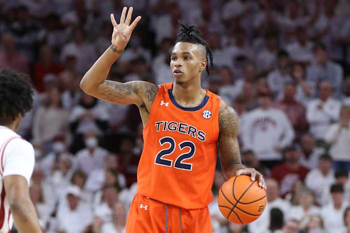 Auburn Tigers guard Allen Flanigan (22) signals during the first half against the Arkansas Razorbacks at Bud Walton Arena.