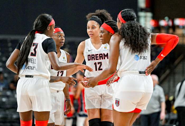 Members of the Atlanta Dream huddle