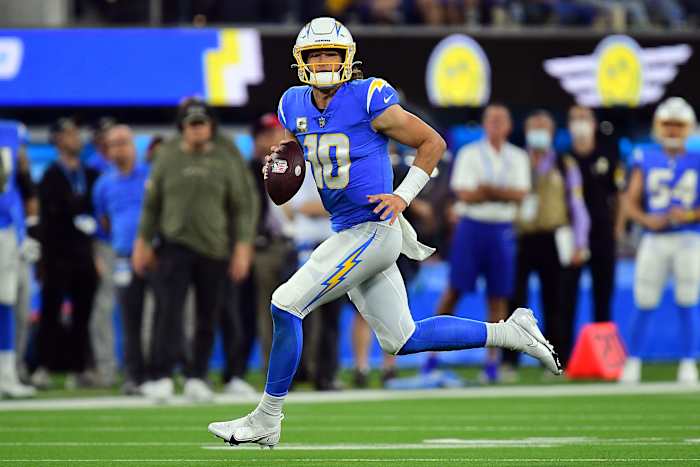 Nov 21, 2021; Inglewood, California, USA; Los Angeles Chargers quarterback Justin Herbert (10) runs the ball against the Pittsburgh Steelers during the first half at SoFi Stadium. Mandatory Credit: Gary A. Vasquez-USA TODAY Sports