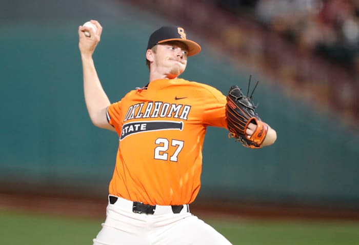 May 26, 2021; Oklahoma City, Oklahoma, USA; Oklahoma St. pitcher Justin Campbell (27) delivers a pitch to Oklahoma during the Big 12 Conference Baseball Tournament at Chickasaw Bricktown Ballpark. Mandatory Credit: Alonzo Adams-USA TODAY Sports