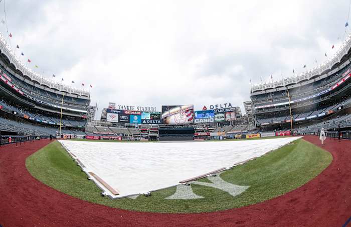 Mar 31, 2019; Bronx, NY, USA; A tarp covers the infield during a rain delay before a game between the New York Yankees and the Baltimore Orioles at Yankee Stadium. Mandatory Credit: Vincent Carchietta-USA TODAY Sports