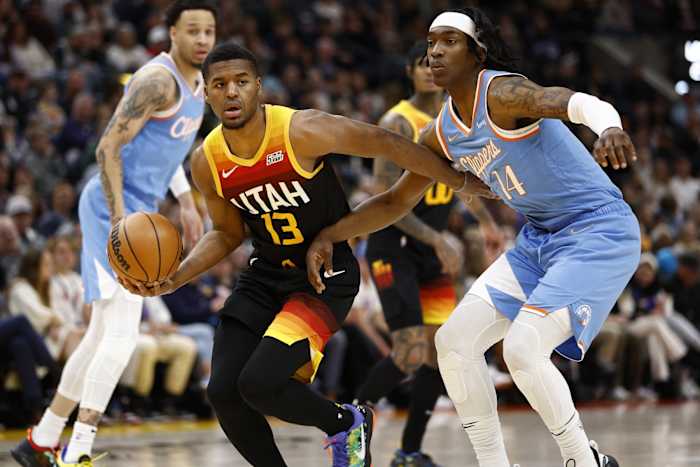 Utah Jazz guard Jared Butler (13) looks to pass against LA Clippers guard Terance Mann (14) in the second quarter at Vivint Arena.