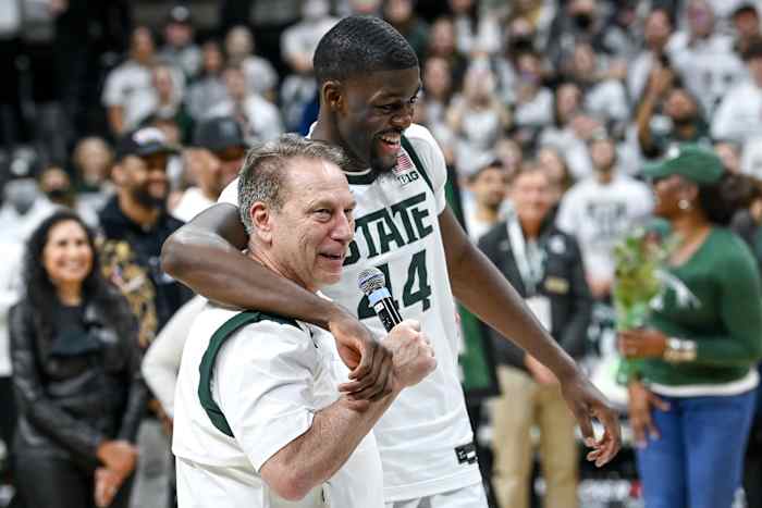 Michigan State's head coach Tom Izzo, left, talks about Gabe Brown during a senior night ceremony after the game against Maryland on Sunday, March 6, 2022, at the Breslin Center.