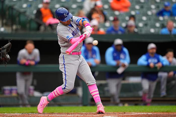 May 8, 2022; Baltimore, Maryland, USA; Kansas City Royals second baseman Whit Merrifield (15) hits a sacrifice fly ball to score a run against the Baltimore Orioles during the second inning at Oriole Park at Camden Yards. Mandatory Credit: Gregory Fisher-USA TODAY Sports