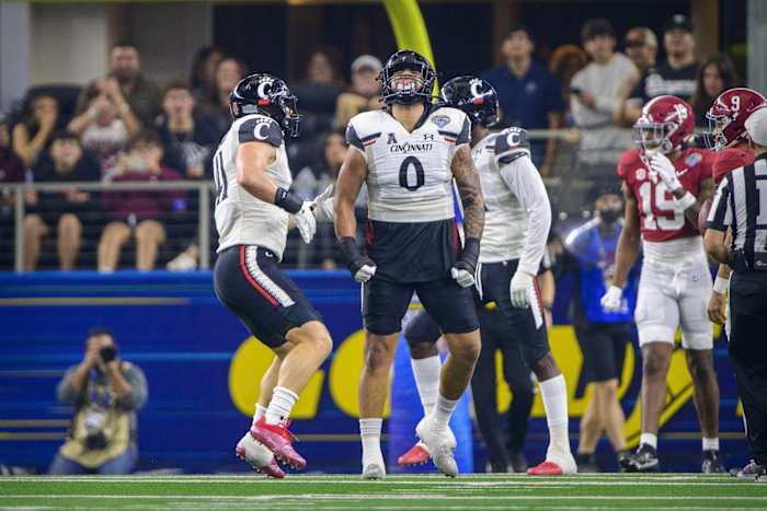 Dec 31, 2021; Arlington, Texas, USA; Cincinnati Bearcats linebacker Darrian Beavers (0) celebrates a sack against the Alabama Crimson Tide during the second quarter during the 2021 Cotton Bowl college football CFP national semifinal game at AT&T Stadium.