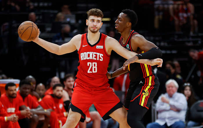 Houston Rockets center Alperen Sengun (28) controls the ball as Atlanta Hawks forward Onyeka Okongwu (17) defends during the fourth quarter at Toyota Center.