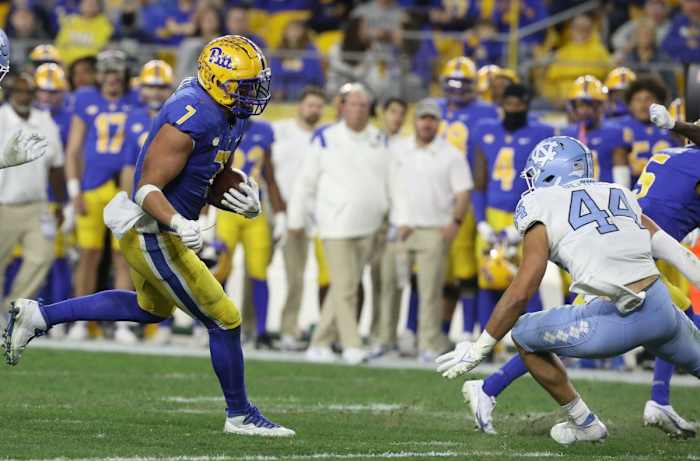 Pitt tight end Lucas Krull (7) runs after a catch as North Carolina linebacker Jeremiah Gemmel (44) defends. Mandatory Credit: Charles LeClaire-USA TODAY Sports