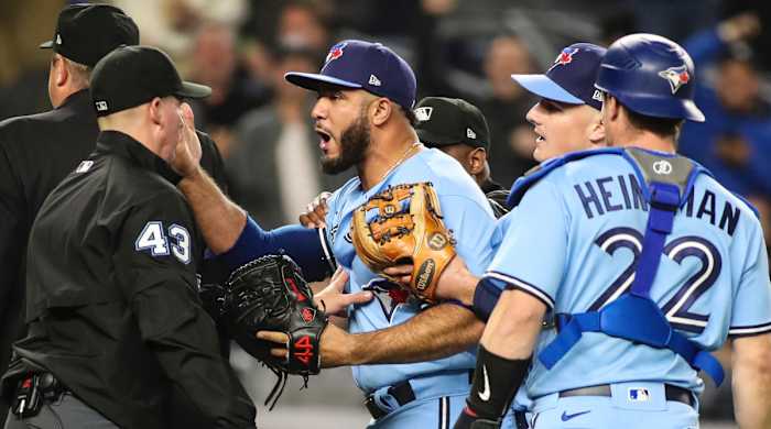 Toronto Blue Jays relief pitcher Yimi Garcia (93) argues with umpire Shane Livensparger (43) after being ejected in the sixth inning against the New York Yankees at Yankee Stadium.