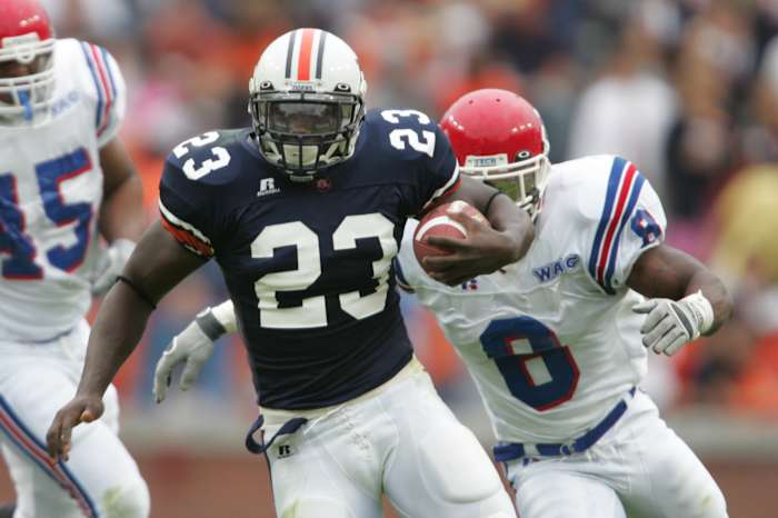 Oct 9, 2004; Auburn, AL, USA; Auburn Tigers running back #23 Ronnie Brown runs through the Louisiana Tech Bulldogs defensive line in 1st half action at Jordan-Hare Stadium. Mandatory Credit: Photo By Jason Parkhurst-USA TODAY Sports Copyright (c) 2004 Jason Parkhurst