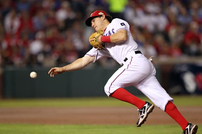 Oct 23, 2011; Arlington, TX, USA; Texas Rangers second baseman Ian Kinsler throws to first base in the sixth inning of game four of the 2011 World Series against the St. Louis Cardinals at Rangers Ballpark.