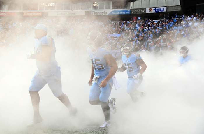 Tennessee Titans players take the field during player introductions before the game against the Houston Texans at Nissan Stadium.