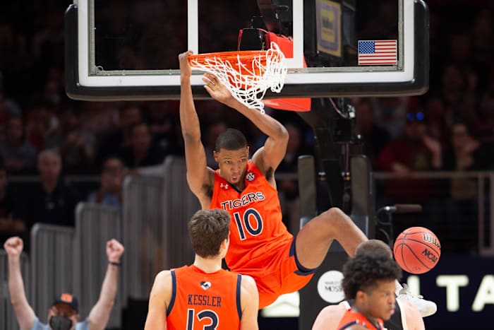 Auburn forward Jabari Smith (10) dunks during the second half of an NCAA college basketball game against Nebraska, Saturday, Dec. 11 , 2021, in Atlanta. (AP Photo/Hakim Wright Sr.)
