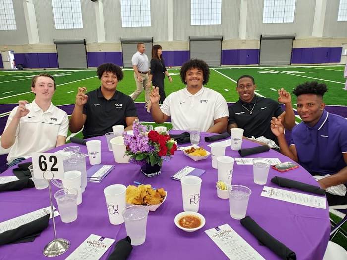 TCU Football players at 2022 TCU FCA Night of Champions Banquet