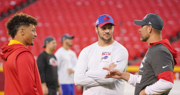 Oct 10, 2021; Kansas City, Missouri, USA; Kansas City Chiefs quarterback Patrick Mahomes (15) talks with Buffalo Bills quarterback Josh Allen (17) and quarterback Chad Henne (4) (left to right) before the game at GEHA Field at Arrowhead Stadium. Mandatory Credit: Denny Medley-USA TODAY Sports
