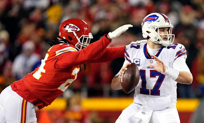 Jan 23, 2022; Kansas City, Missouri, USA; Buffalo Bills quarterback Josh Allen (17) drops back to pass under pressure from Kansas City Chiefs linebacker Melvin Ingram (24) during the first quarter in the AFC Divisional playoff football game at GEHA Field at Arrowhead Stadium. Mandatory Credit: Jay Biggerstaff-USA TODAY Sports