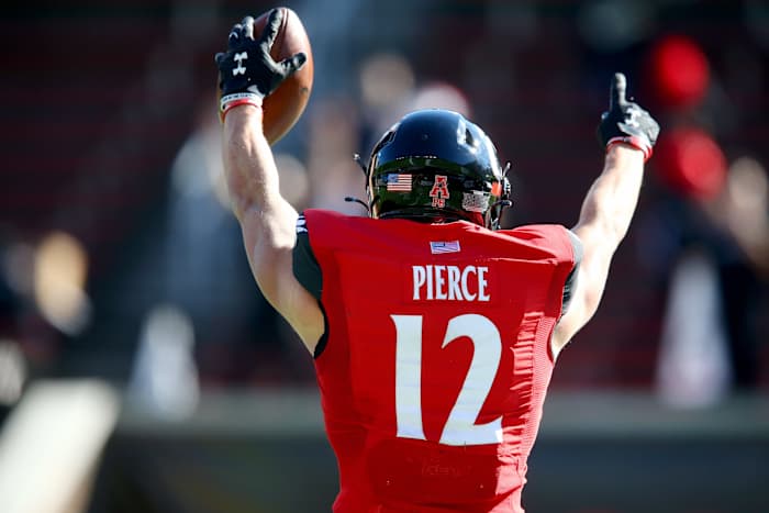 Cincinnati Bearcats wide receiver Alec Pierce (12) gestures toward an official after catching a touchdown pass during the first quarter of a college football game against the Memphis Tigers, Saturday, Oct. 31, 2020, at Nippert Stadium in Cincinnati. Ncaa Football Memphis At Cincinnati