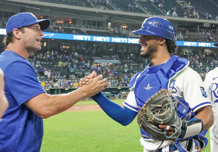 May 17, 2022; Kansas City, Missouri, USA; Kansas City Royals catcher MJ Melendez (1) celebrates with manager Mike Matheny (22) after the win over the Chicago White Sox at Kauffman Stadium. Mandatory Credit: Denny Medley-USA TODAY Sports