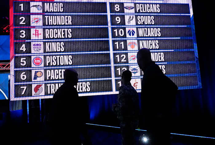May 17, 2022; Chicago, IL, USA; People look at the draft lottery order after the 2022 NBA Draft Lottery at McCormick Place.